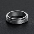 SBE002-CZStonesInCenterSpinnerStainlessSteelRing.jpg