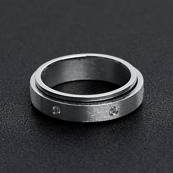 SBE002-CZStonesInCenterSpinnerStainlessSteelRing.jpg