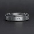SBE002-CZStonesInCenterSpinnerStainlessSteelRing_Black1.jpg