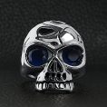 SCR4111-Blue-CZ-Eyed-Jawless-Skull-Stainless-Steel-Ring-Lifestyle-Front_e46c23c6-b70e-47e0-aeb4-d7b5792464c1.jpg